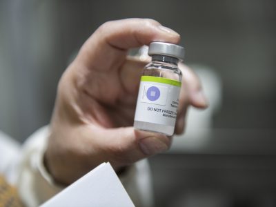 Immunologist of the Jalal-Abad region Aliya Arykbayeva shows the vaccine expiration date in the refrigerator at the Immunization Center in Jalal-Abad city, Kyrgyzstan.